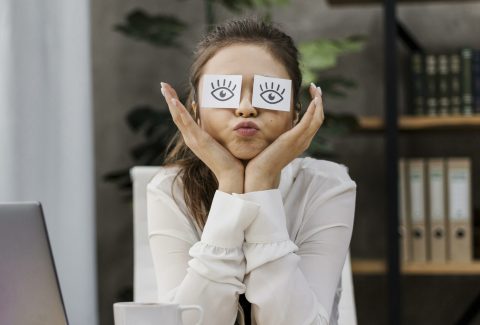 businesswoman-looking-silly-with-her-eyes-covered