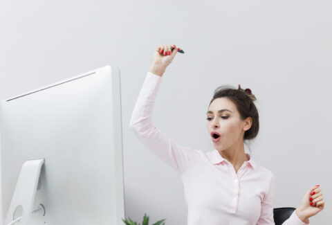 front-view-happy-woman-finding-out-good-news-while-working-computer