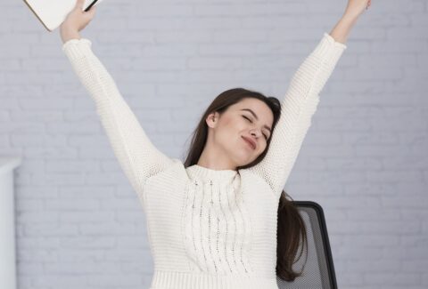 woman-stretching-chair-office